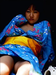 Ayami Sakurai posing big breasts in colored suite