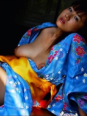 Ayami Sakurai posing big breasts in colored suite