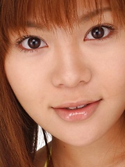 Av idol Yoko Matsugane posing in yellow bikini
