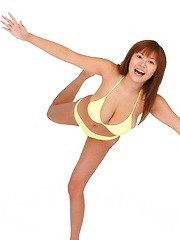 Av idol Yoko Matsugane posing in yellow bikini
