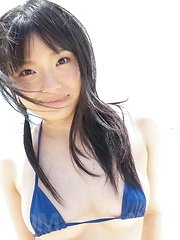 Hina Maeda Asian licks balls and rubs tool with feet on beach