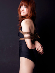 Lala Asian babe in bath suit has hands tied of her boobs in ropes