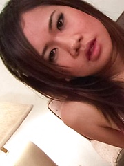 Eve Asian nymphet rubs her cunt with long nails and sucks shlong