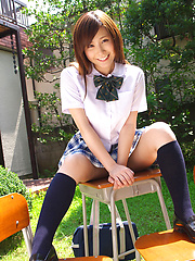 Schoolgirl Iyo Hanak poses at the open air in sexy skirt