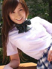 Schoolgirl Iyo Hanak poses at the open air in sexy skirt