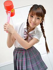 Mizuho Shiraishi Asian with uniform and pigtails plays like child