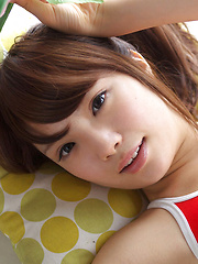 Manami Sato Asian with sexy curves in bath suit plays with pillow