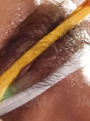 Satomi Suzuki Asian gets vibrators on hairy pussy and drinks cum