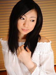 Emiko Koike teases in white lingerie on bed