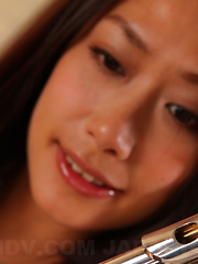 Slutty Yayoi Yanagida posing with her flute